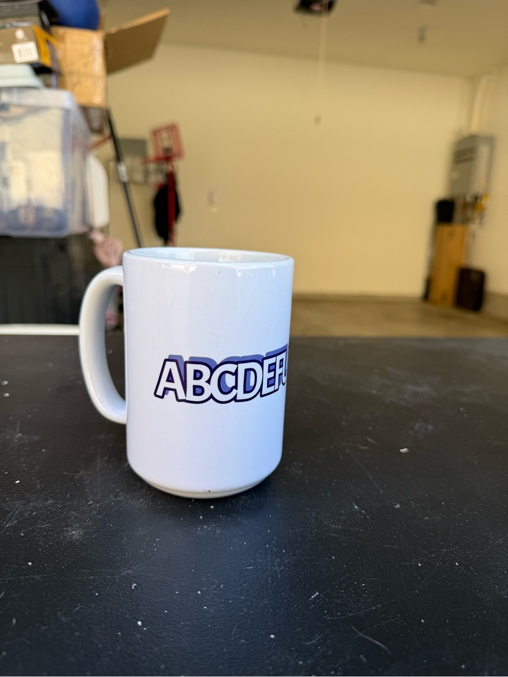 ABCDERF White Ceramic Coffee Mug with Blue Logo